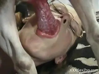 Nerdy amateur zoophile knows how to suck dog dick in a proper way