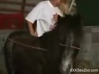 Blond-haired beauty gets fucked by a small horse