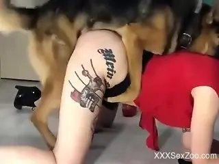 Inked-up beauty cums with a dog cock buried inside