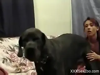 Skinny redhead sucking on a dog's big cock here