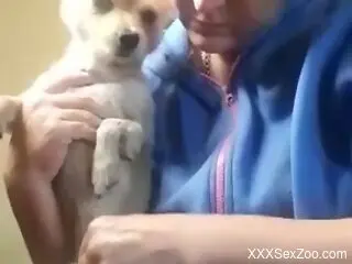 Aroused woman shows off sucking her dog's little cock on cam
