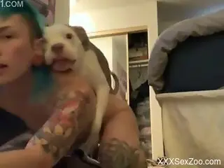Dog makes inked woman feel amazing while nude on cam