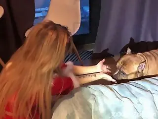 Aroused blonde lets her muscular dog fuck her pussy on cam