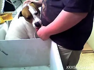 Horny man wants to push his whole dick in the dog's mouth
